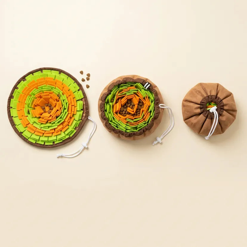 Top-down view of the snuffle bowl three ways on natural linen: open flat as a mat, gathered into a bowl, and closed into a pouch